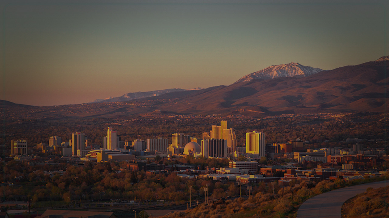 Reno skyline themed Pine Script service cover with dark market grading