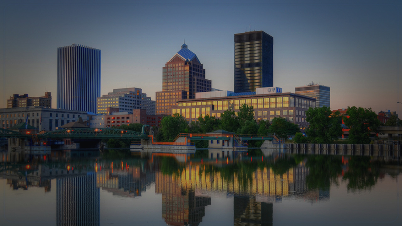 Rochester skyline themed Pine Script service cover with dark market grading
