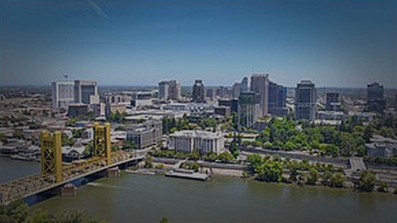 Sacramento skyline themed Pine Script service cover with dark market grading