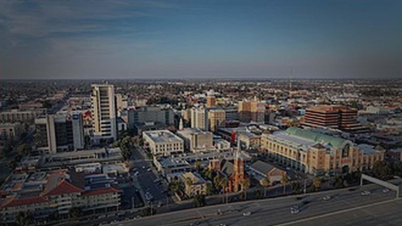 Stockton skyline themed Pine Script service cover with dark market grading