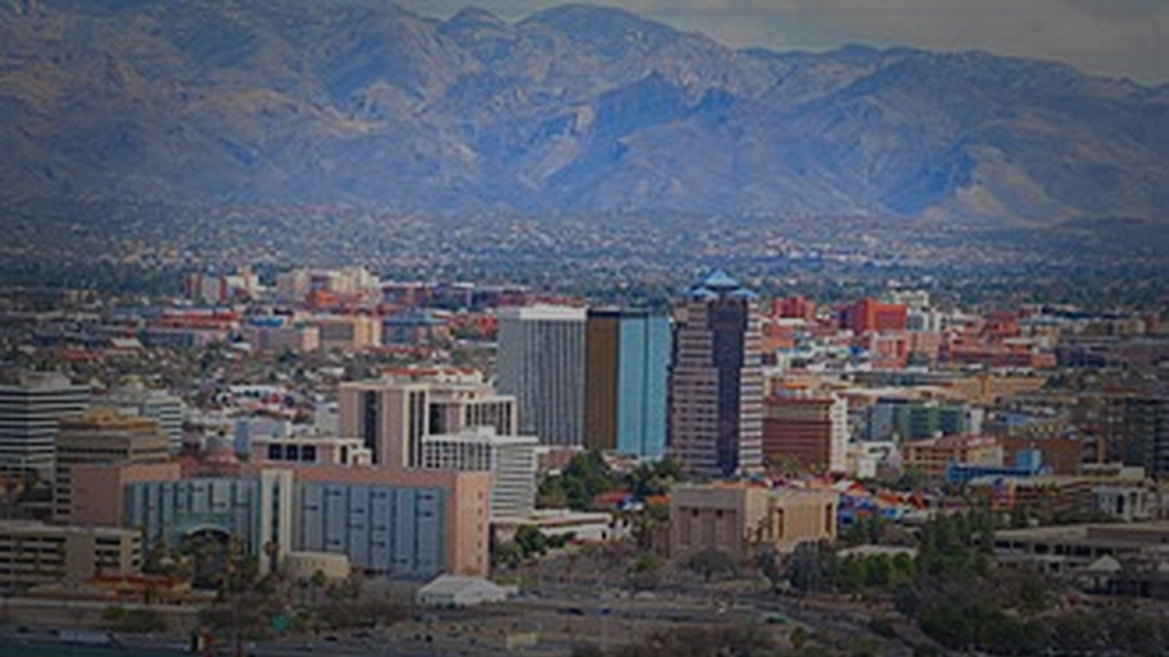 Tucson skyline themed Pine Script service cover with dark market grading